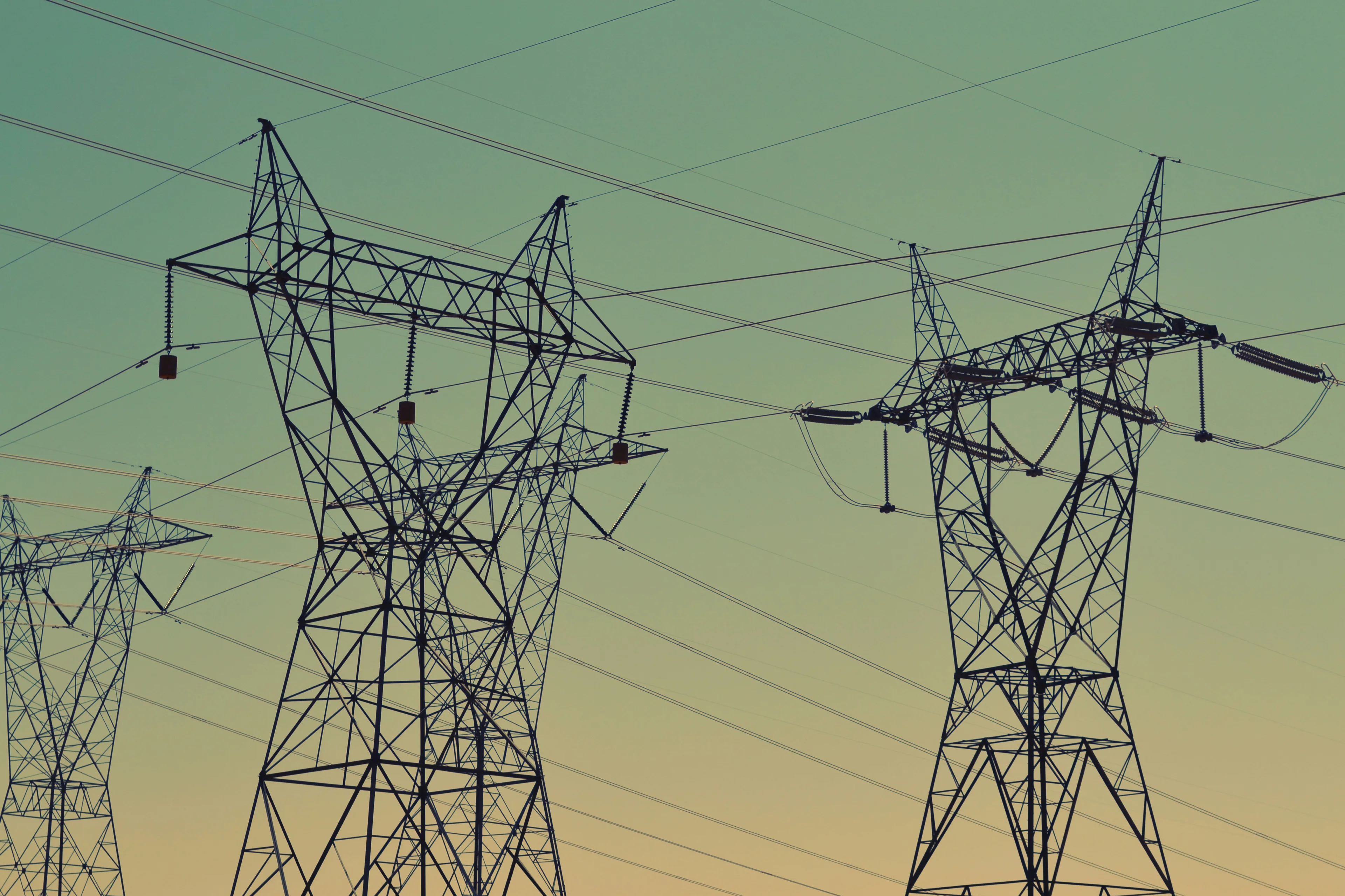 Two power lines intersecting. Photo by Fré Sonneveld on Unsplash